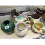 A collection of various Poole Pottery items to include a Poole Pottery Squat vase,