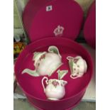 A Royal Albert three piece china gift set comprising a teapot, milk jug and sugar bowl,