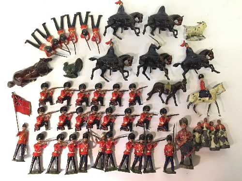 Quantity of lead figures by Britains and others, includes Kneeling Coldstream Guards,