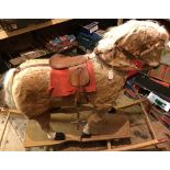 Mid 20th Century Rocking Horse: wood and composition body with real fur, on wooden rocker base.