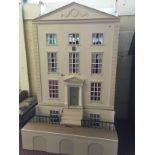 'Bath House' Kit-Built Doll's House, with six rooms and hinged panels to front, includes basement