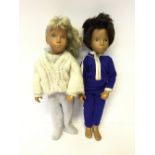 Two Sasha Dolls: Gregor boy doll with dark brown hair and brown eyes,