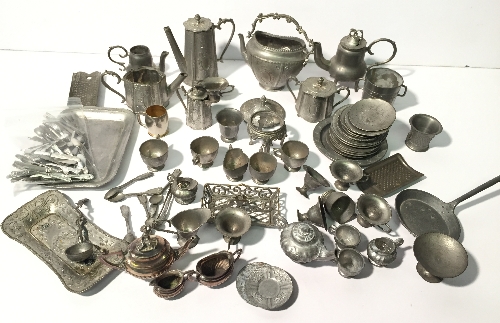 Good quantity of miniature metal pots, pans and utensils with intricate patterning,