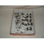 A tray containing new SCALEXTRIC spares - 5 x Motors for Micro Cars with chassis guide, wheels,