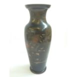 A late 19th century Japanese bronze vase, decorated with figures on a carp.