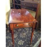 A mahogany Sutherland table with drawer to front, resting on four turned supports.