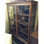 A large early 20th century mahogany double door astragal glazed display cabinet.