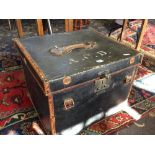 A late 19th century canvas and leather trunk.