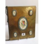 A French brass desk blotter with five hand painted Sevres style porcelain oval pannels with gilt