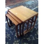 A nest of three mid 20th century teak G Plan Fresco coffee tables.