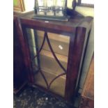 An early 20th century glazed mahogany display cabinet.