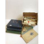 Four various stamp albums and contents together with a stamp reference book.