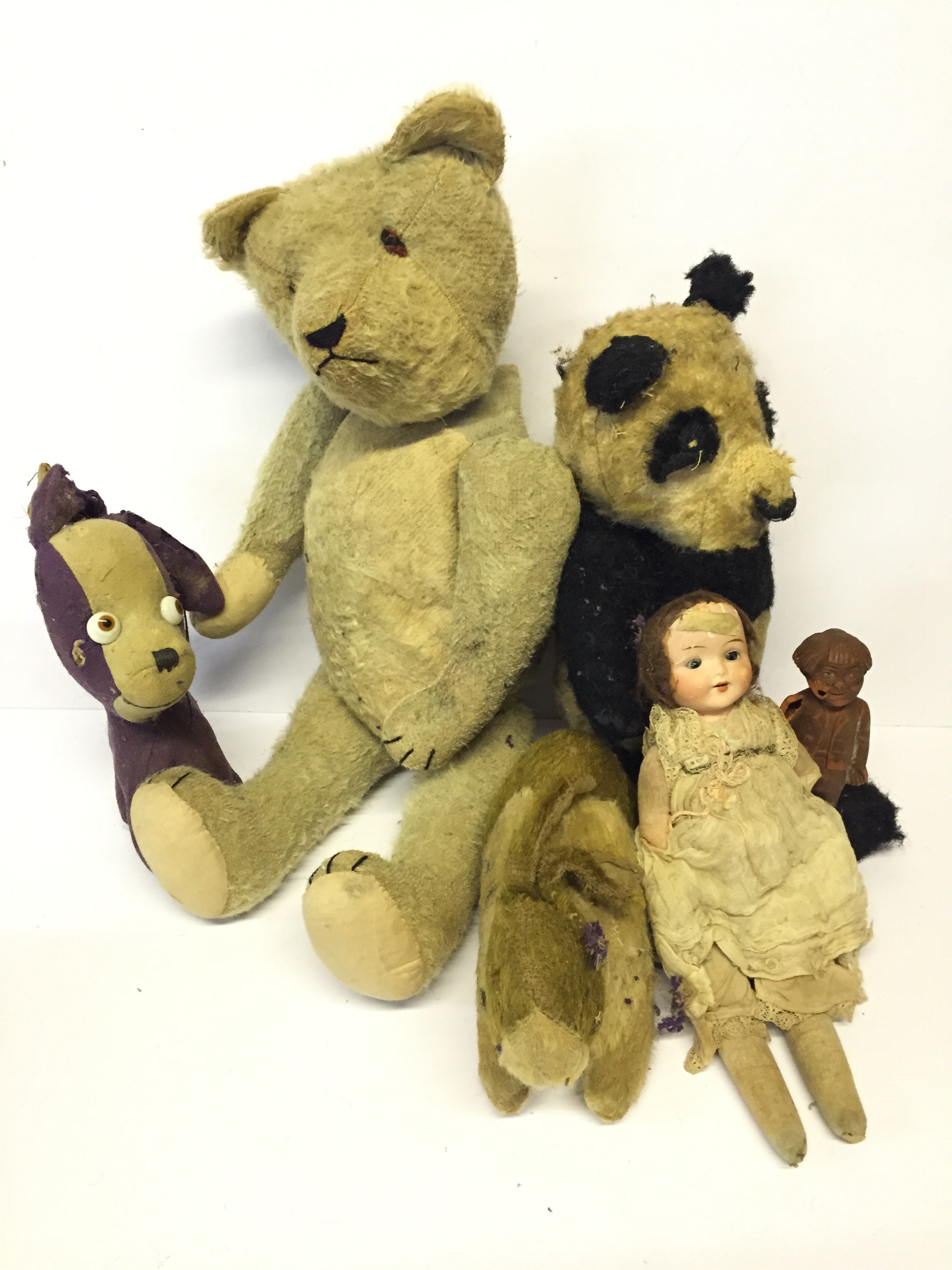 Early 20th Century Teddy Bear: mohair with disc joints, felt eyes, stitched nose, mouth and claws,