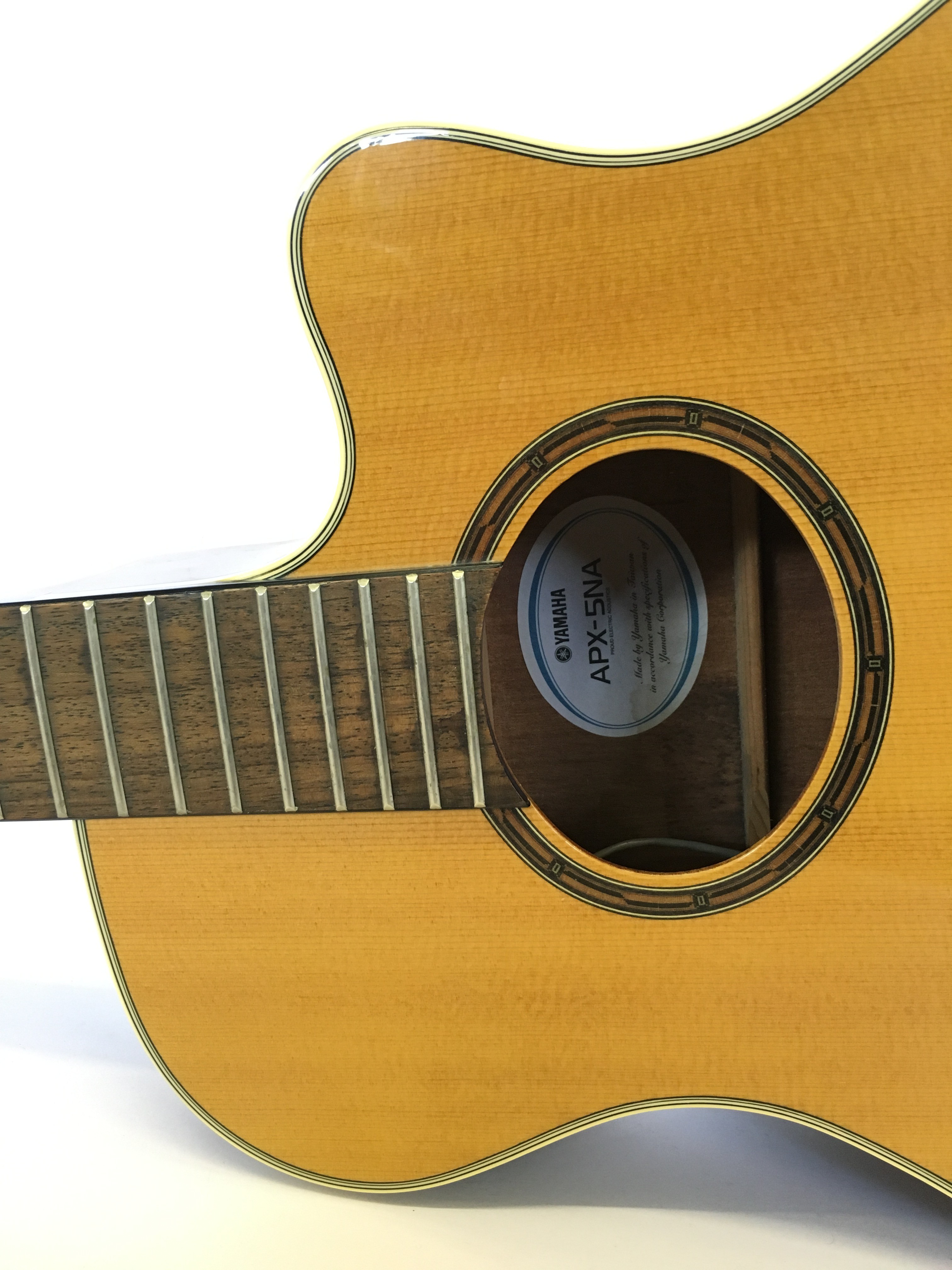 A Yamaha APX5NA six string acoustic guitar (unstrung) with electric