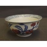 A small Chinese blue and white porcelain rice bowl with red fruit decoration, 4'' diameter