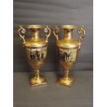 A pair of twin handled porcelain vases decorated with Russian military scenes on a matt and bright