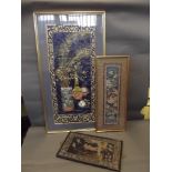 Three framed Oriental embroideries decorated with figures and birds, 31'' x 14''