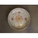 A C19th Chinese duck egg blue ground porcelain bowl with polychrome enamel scrolling floral