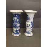 A pair of C20th Chinese Gu shaped porcelain vases decorated with painted landscape scenes in the