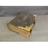 A brass bound copy of 'The National Family Bible', with commentaries of Scott & Henry, specially