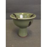 A Chinese Long Chen Kiln green glazed stem cup with relief tortoise decoration, 3'' high