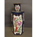 A hexagonal Samson blue ground vase painted with panels of exotic birds, flowers, butterflies and