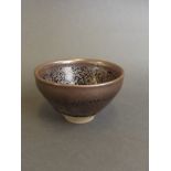 A small Chinese Jin kiln pottery bowl with iridescent splash glaze decoration,