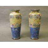 A large pair of Royal Doulton vases with flambé blue ground and Art Nouveau decoration,