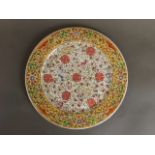 A Chinese famille jaune enamel plate with scrolling floral and bat decoration, 6 character mark,