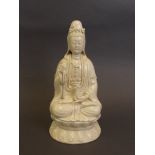 A Chinese blanc-de-chine porcelain figure of Quan Yin holding a vase, impressed mark verso,