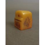 A Chinese yellow soapstone seal with inscribed calligraphy decoration,