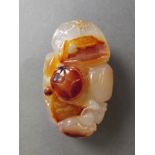 A Chinese carved agate ornament with toad decoration,