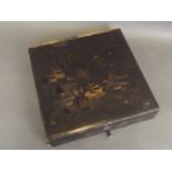 An Oriental lacquer box decorated with gilt Chinoiserie decoration to lid,