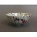 A Chinese celadon crackle glazed porcelain bowl with a petal shaped rim,