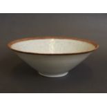 A Chinese celadon glazed Sung dynasty style bowl with incised foliate and figural decoration,