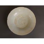 A Chinese petal shaped celadon ground porcelain dish with incised lotus flower decoration,