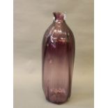 A hand blown Bohemian amethyst glass vase of twisted form,