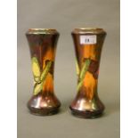 A pair of Burslem lustreware vases with butterfly decoration and gilt highlights,