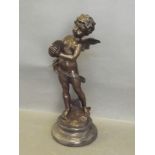 A bronze figure of a winged cherub holding cymbals, on a shaped base, 12'' high