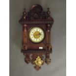 A C19th Dutch walnut and beech wall clock with classical moulded decoration, the porcelain dial with