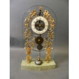 An ormolu and glass skeleton clock, the painted enamel dial inscribed 'Huguenin A. Paris', with