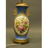 A Sevres style blue ground porcelain twin handled vase with gilt highlights and panels hand