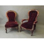 A Victorian gentleman's walnut open armchair with carved decoration and cabriole supports, and