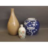 A Chinese blue and white prunus pattern ginger jar, and two other Oriental vases, 10½'' high