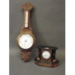 A late C19th walnut mantle clock with ebonised detail, the enamel dial with Roman numerals, striking
