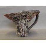 A Chinese horn libation cup carved with mythical beasts, 4½'' high