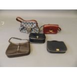 Four 'Celine, Paris' handbags (three in leather), and another leather handbag