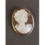 A 9ct gold cameo pendant depicting a classical silhouette of a lady, 1'' long