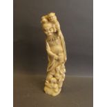 A Meiji period ivory carving of a robed man and two monkeys, 10½'' high (AF loss to base)