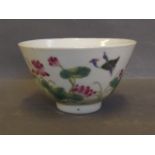 A famille rose tea bowl decorated with birds and flowers, printed mark to base, 4'' diameter